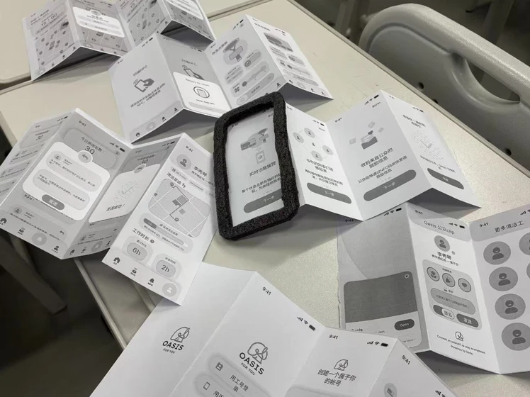 OASIS paper prototype screens on desk