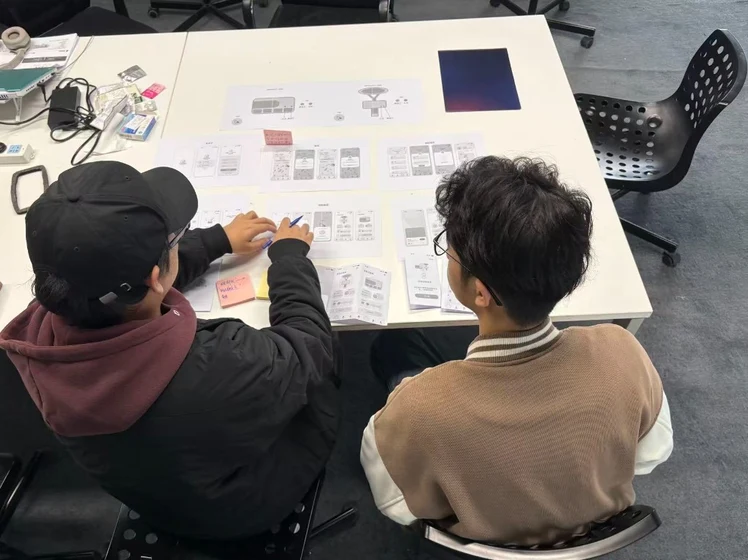 Collaborative UI sketching session at table